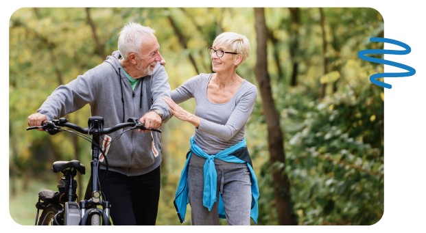 Older couple comforting one another while exercising outside.