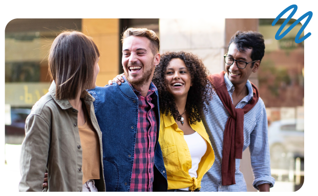 Group of mena and women with arms around one another having a good time and smiling.