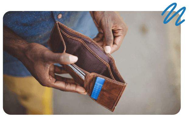 Man holding open wallet with no cash.