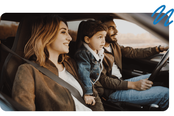 Family of three sitting in front seat of car looking out at road ahead.